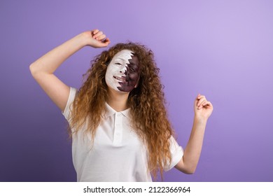 Dancing Fan Football Redhead Woman Raising Hands Up With Face Painted In Qatar Flag On Violet Background Celebrating Team Victory At The Championship.