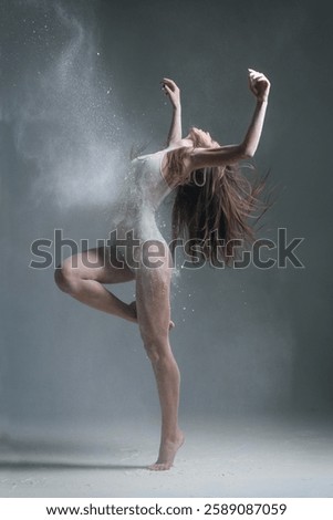 Dancing in flour dancer posing on a studio background 