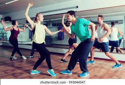 Dancing Happy Couples Learning Swing At Dance Class