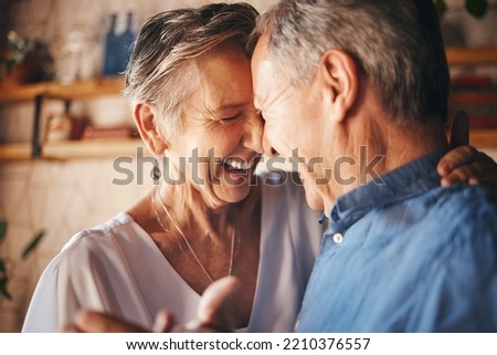 Dancing, happy senior couple smile together and dance with love in retirement. Anniversary celebration at home, mature married healthy man and active woman support each other in retired old age