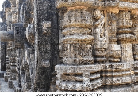 Dancing lovemaking and mythical characters in stone at Konark Sun Temple India. Ruins of Konark Sun Temple in India. 13th centuries old temple was constructed as a chariot of Sun god with wheels reins and horses. The structure and elements are famous for the intricate artwork and its theme of love. This is now a World Heritage Site declared by UNESCO.