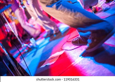Dancing at a party with red and blue lights