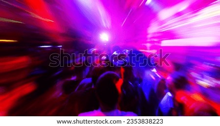 Dancing people in a disco club to the music