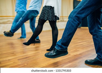 Dancing people in a row in the dance hall salon. Dancing school activity