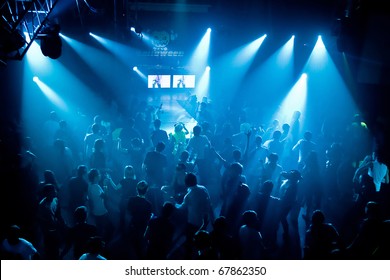 Dancing People In An Underground Club, Blue Stage Light.