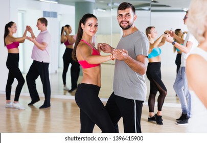 Dancing Positive Swiss Couples Learning Salsa At Dance Class