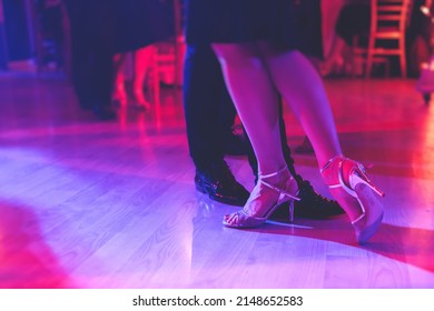 Dancing Shoes Of A Couple, Couples Dancing Traditional Latin Argentinian Dance Milonga In The Ballroom, Tango Salsa Bachata Kizomba Lesson, Festival On A Wooden Floor, Purple, Red And Violet Lights
