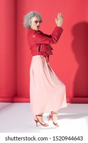 Dancing And Singing. Mature Curly Woman Wearing High-heeled Shoes Dancing And Singing