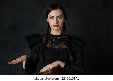 Dancing woman with pigtails in a gothic style on a dark background - Shutterstock ID 2248813171