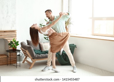 Dancing Young Couple At Home
