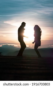 Dancing young couple silhouette during sunset in Cappadocia