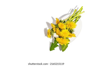 Dandelion flowers bouquet on trendy stand isolated on a white background. Springtime concept, floral element for design festive card, a hard light, dark shadow, top view - Powered by Shutterstock
