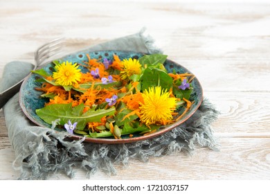 Dandelion Salad In A White Plate On A Light Table, Vegetarian Food Concept