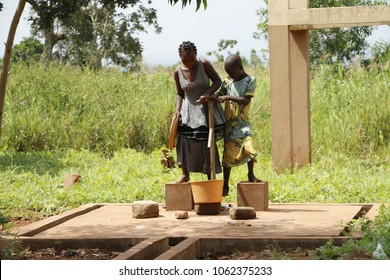 Dangbo Benin November 17 2015  Girls Pumping Water From The Well