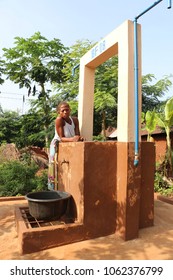 Dangbo Benin November 17 2015  Woman Stands At A Water Well To Take Water