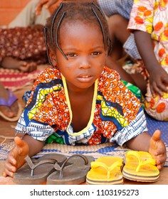 Dangbo Benin November 17 2015 Girl Watches Over Slippers