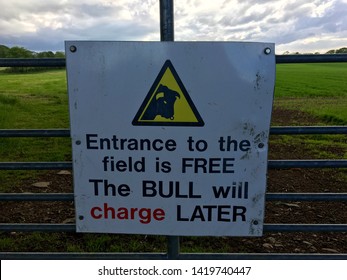 Danger bull in field sign "entrance to the field is FREE, The BULL with charge LATER. off of the Dark Hedge in North Ireland