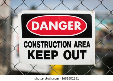 Danger Construction Area Keep Out Sign On Chain Link Fence