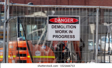 Danger, Demolition Work In Progress Sign In A Real Construction Site. 