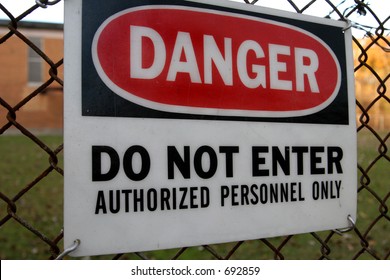 Danger do not enter sign on fence