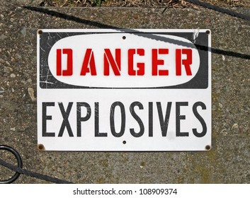 danger explosives, warning message on signboard on stone wall, mined restricted area, ammunition depot, hazard environment, military security diversity