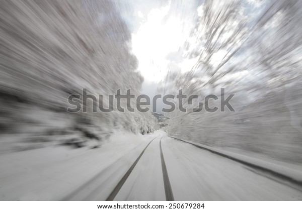 Danger fast driving at snowy road, Motion blur\
the high speed and dynamics.\
