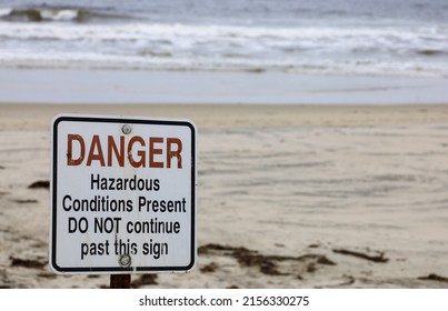 A Danger hazardous conditions present do not continue past this sign, sign. - Shutterstock ID 2156330275