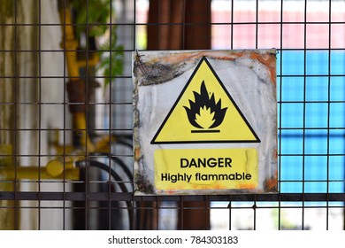 Danger highly flammable sign on blurred background