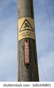 A danger keep off sign on an electrical pylon