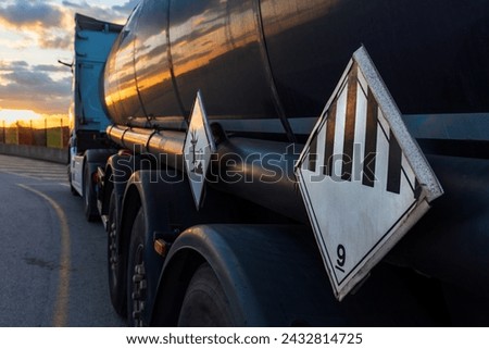 Danger labels on a tanker truck with dangerous goods, with the number nine of various dangers and environmental contaminants