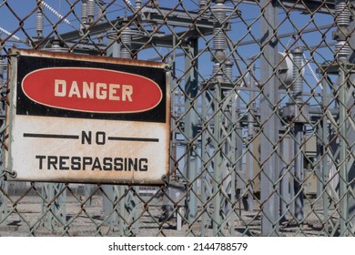 DANGER - NO TRESPASSING sign at an electrical substation. - Shutterstock ID 2144788579