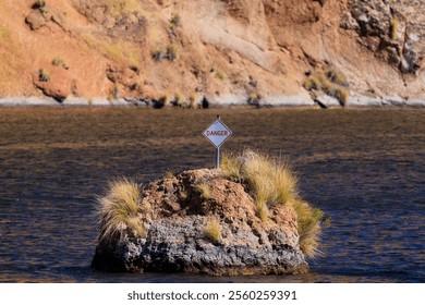 A danger sign in Canyon Lake warns boaters of submerged hazards. Near Phoenix, Arizona. - Powered by Shutterstock