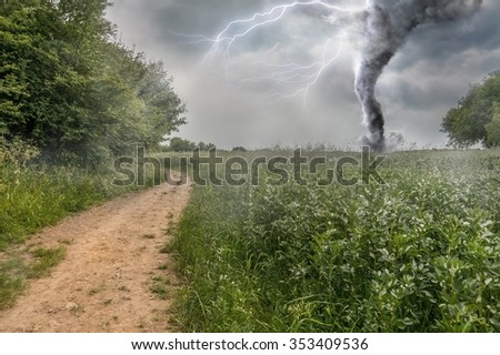 Danger storm producing a Tornado over green field