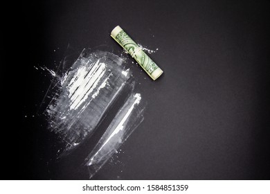 The Dangerous Cocaine With One Dollar. Heroine On Black Background. 