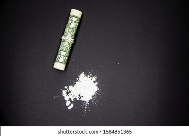 The Dangerous Cocaine With One Dollar. Heroine On Black Background. 