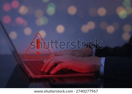 Dangerous cyber attack with red warning triangle showing spyware monitoring computer system privacy breach risk and hacker threat crime on laptop