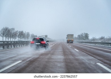 Dangerous driving behavior of a motorist on a fast road in slippery and wintry conditions - Shutterstock ID 2237862557