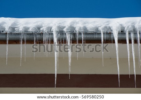Dangerous icicles. Fines for snow and ice on roofs.