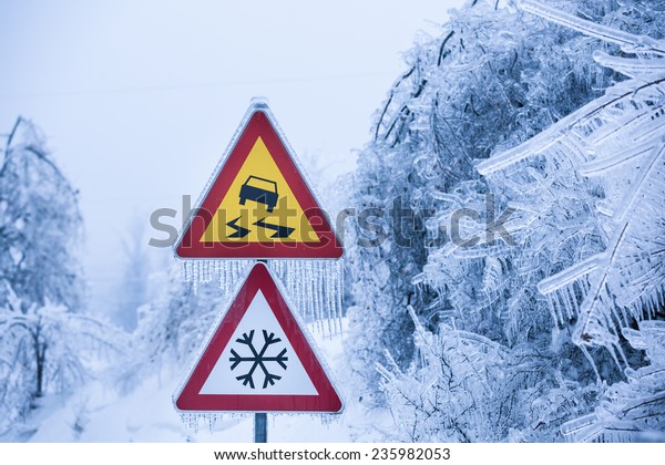 Dangerous and icy\
road with sleet covered\
trees