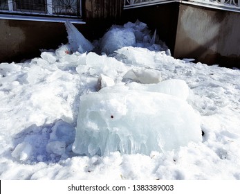 A dangerous large ice block fell from a roof in winter or spring