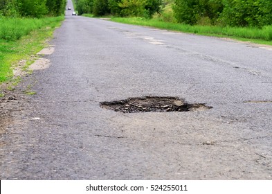 Dangerous Pothole In The Asphalt Highway, Summer