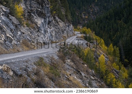 Dangerous road in the mountains along the cliff next to Lussier River in Whiteswan Provincial Park, Kootenay Rockies, British Columbia