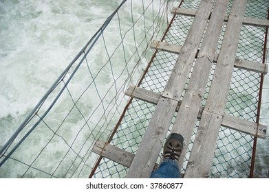 Dangerous Rope Bridge Over Wild River