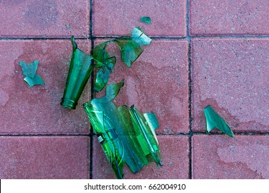 Dangerous Shards Of Glass. Broken Bottle On The Sidewalk.