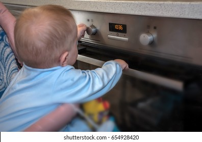 Dangerous Situation, The Child Is Playing With An Electric Stove. The Child Plays Near A Hot Stove.