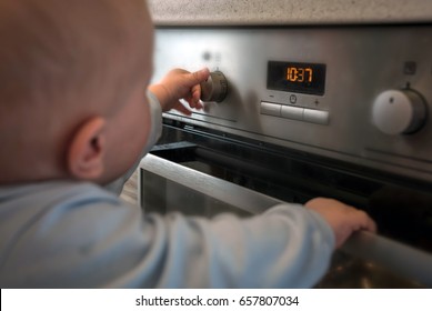 Dangerous Situation, The Child Is Playing With An Electric Stove. The Child Plays Near A Hot Stove.