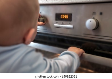 Dangerous Situation, The Child Is Playing With An Electric Stove. The Child Plays Near A Hot Stove.