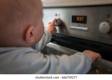 Dangerous Situation, The Child Is Playing With An Electric Stove. The Child Plays Near A Hot Stove.