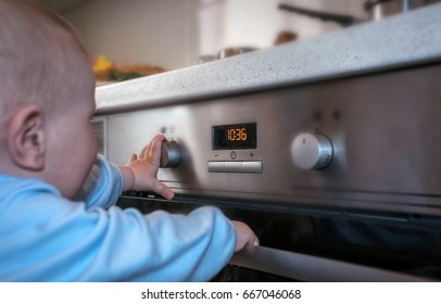 Dangerous Situation, The Child Is Playing With An Electric Stove. The Child Plays Near A Hot Stove.