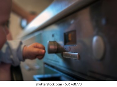 Dangerous Situation, The Child Is Playing With An Electric Stove. The Child Plays Near A Hot Stove.